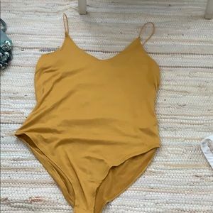 Mustard yellow snap bodysuit
